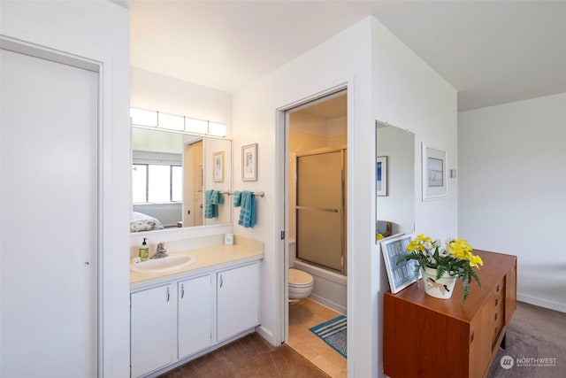 bathroom with tile patterned floors, vanity, and toilet