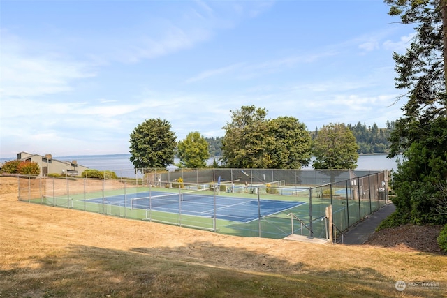 view of sport court featuring a water view