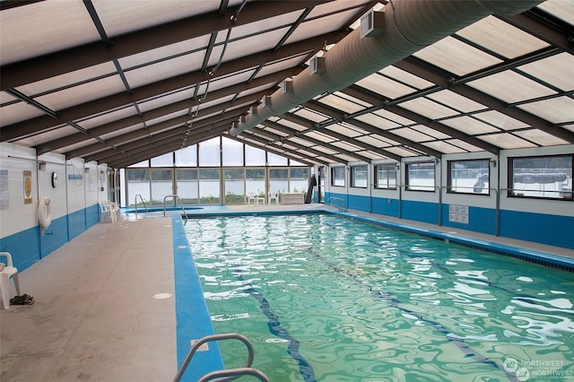 view of pool featuring a water view