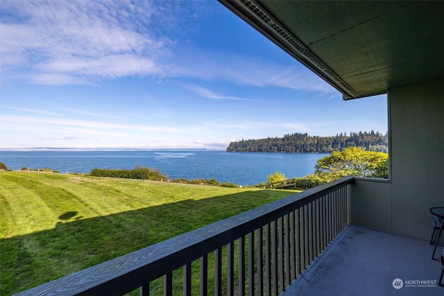 balcony featuring a water view