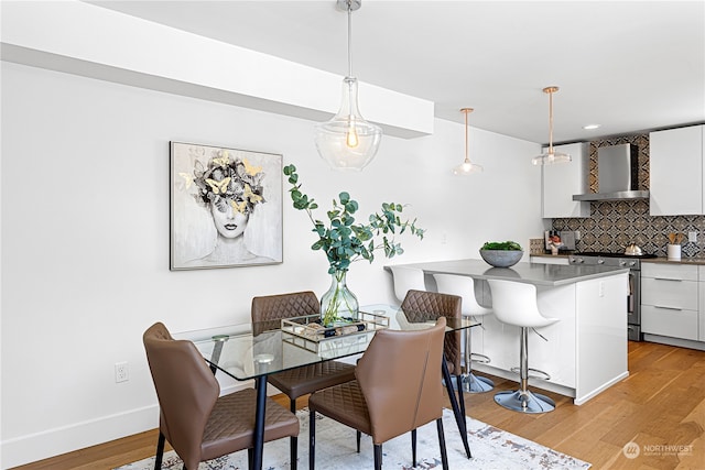 dining space featuring light hardwood / wood-style flooring