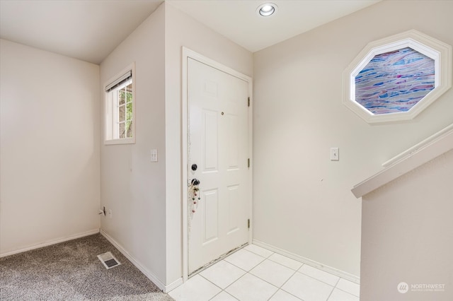 foyer with light carpet