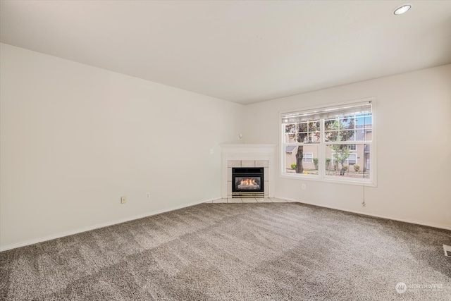 unfurnished living room featuring a fireplace and carpet flooring