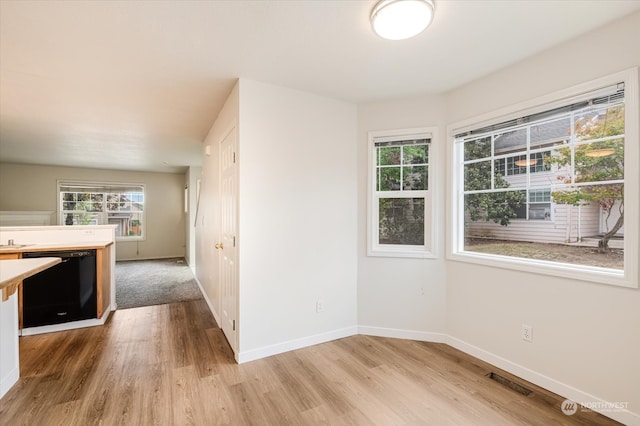 interior space featuring dishwasher and light hardwood / wood-style floors