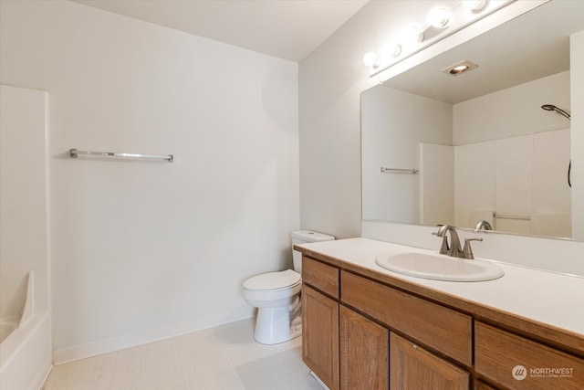 full bathroom featuring shower / washtub combination, vanity, and toilet