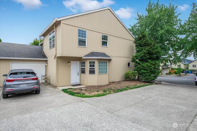 front facade with a garage