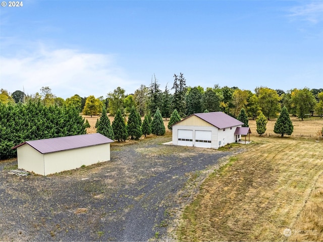 birds eye view of property featuring a rural view