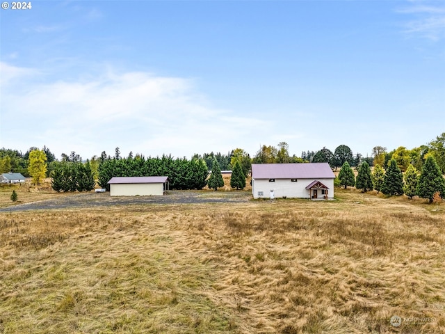 view of yard with a rural view