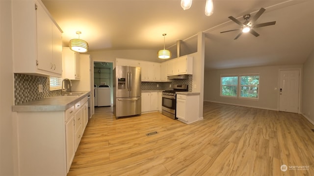 kitchen featuring stainless steel appliances, white cabinetry, ceiling fan, and decorative light fixtures