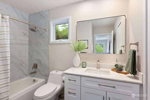 full bathroom featuring shower / bath combo, vanity, and toilet