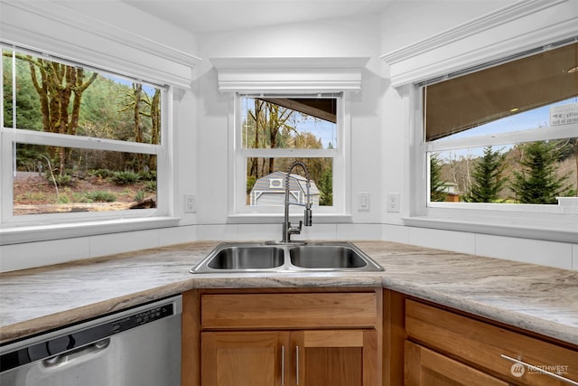 kitchen featuring dishwasher, lofted ceiling, and sink