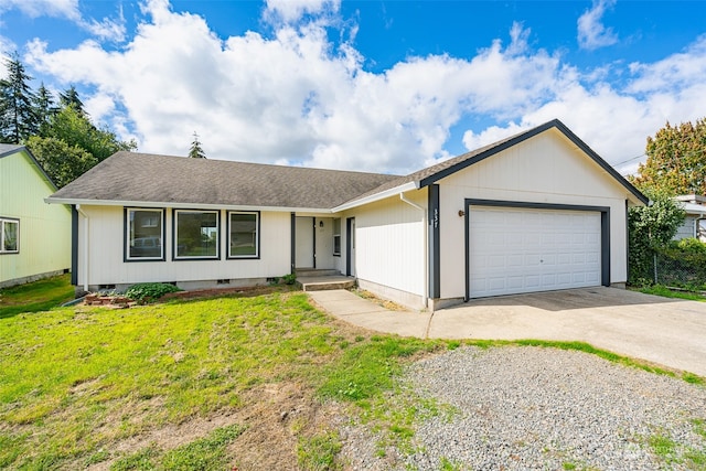 ranch-style home with a garage and a front yard