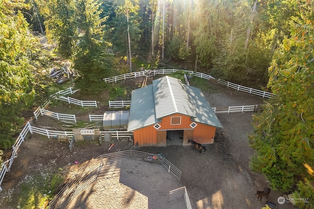 birds eye view of property with a rural view