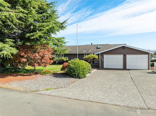 single story home featuring a garage