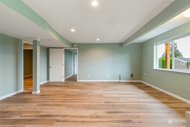 spare room featuring light hardwood / wood-style floors