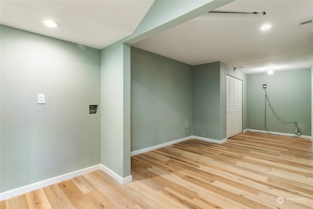 spare room with light wood-type flooring