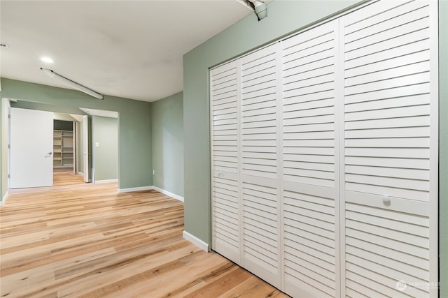 hallway with light wood-type flooring