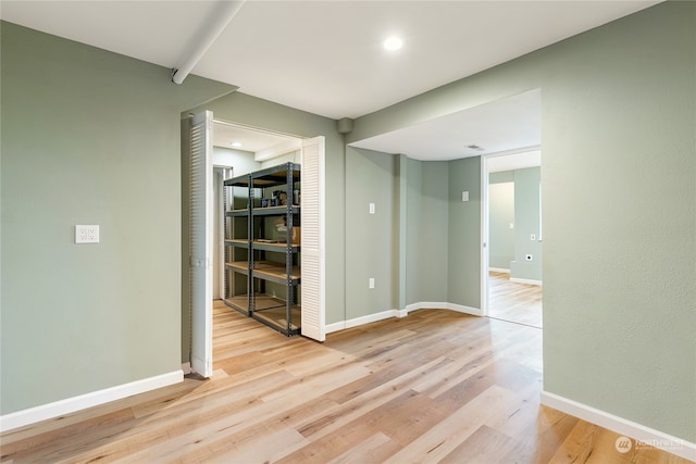 spare room featuring light hardwood / wood-style flooring