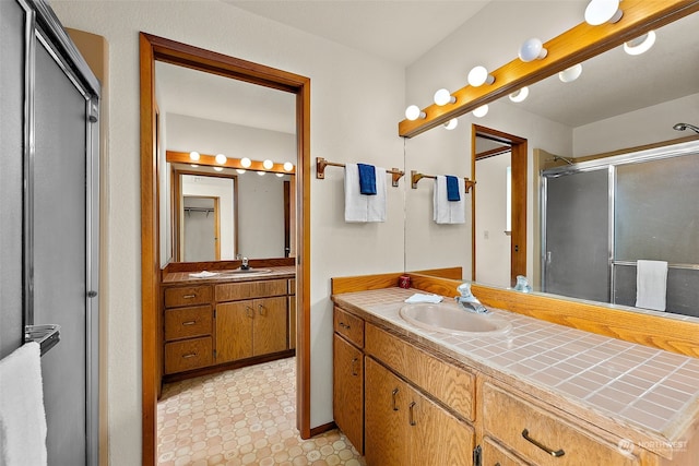 bathroom featuring vanity and walk in shower