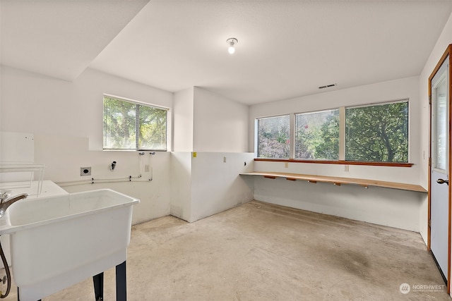 laundry room featuring a wealth of natural light and sink