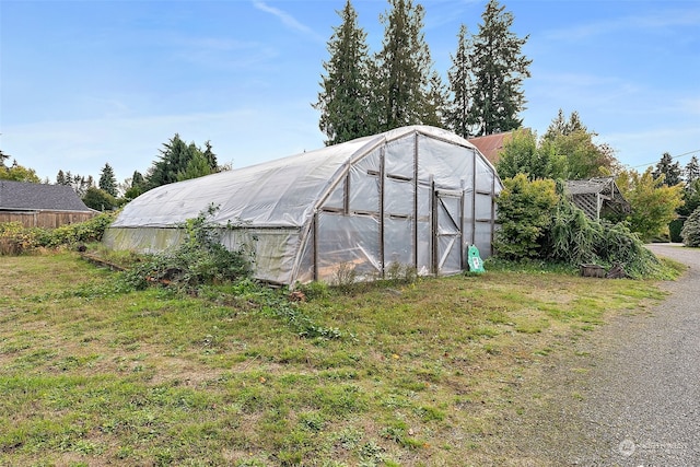 view of outdoor structure featuring a yard