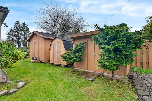 view of yard featuring a storage unit