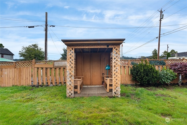 view of outdoor structure featuring a yard