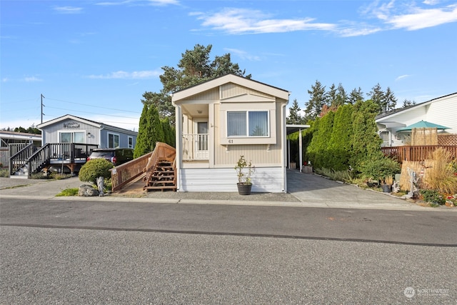 view of front of home with a carport