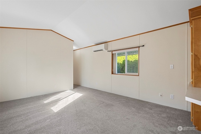 unfurnished room featuring vaulted ceiling, light colored carpet, and a wall mounted air conditioner