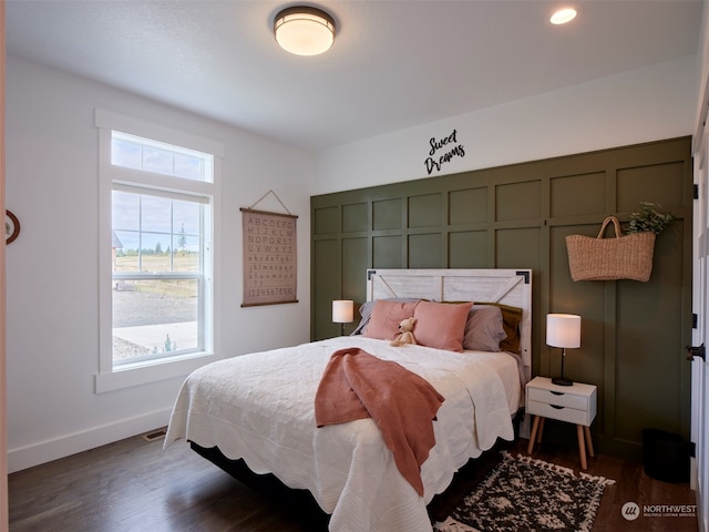 bedroom featuring dark hardwood / wood-style flooring