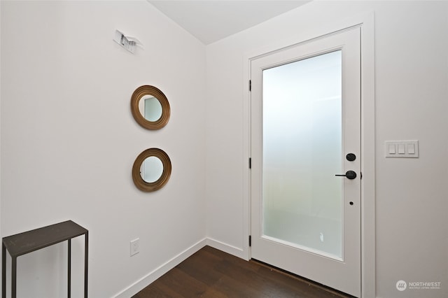 doorway to outside with dark hardwood / wood-style floors