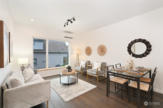 living room with an AC wall unit and dark hardwood / wood-style floors