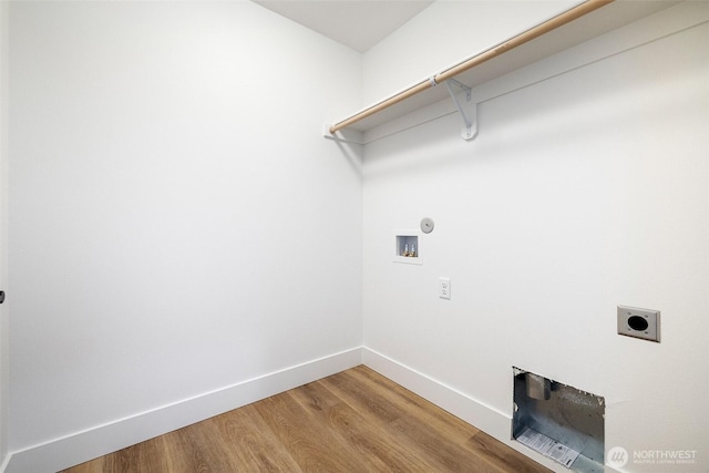 washroom with laundry area, baseboards, wood finished floors, hookup for a washing machine, and electric dryer hookup