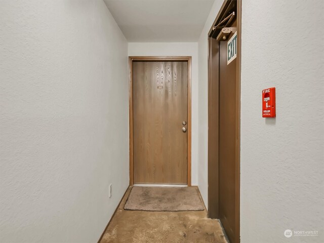 hallway featuring concrete flooring