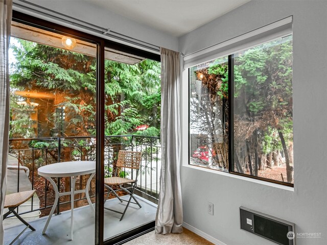 doorway featuring carpet floors