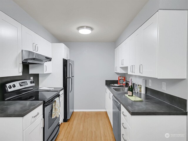 kitchen with light wood-type flooring, white cabinetry, sink, and appliances with stainless steel finishes