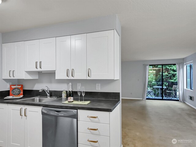 kitchen featuring dishwasher, light carpet, white cabinets, and sink