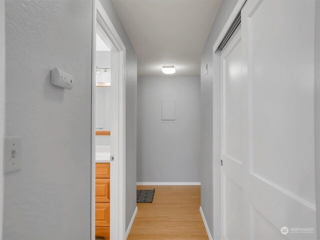 hall with light hardwood / wood-style flooring