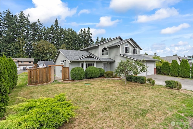 view of front property with a garage and a front yard