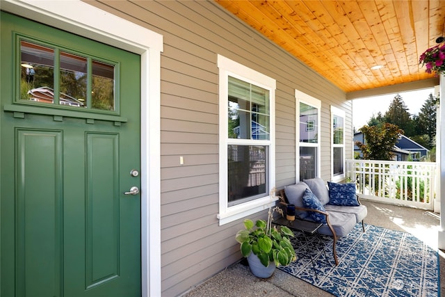 doorway to property featuring covered porch