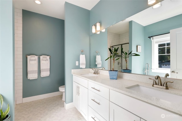 bathroom featuring walk in shower, vanity, and toilet