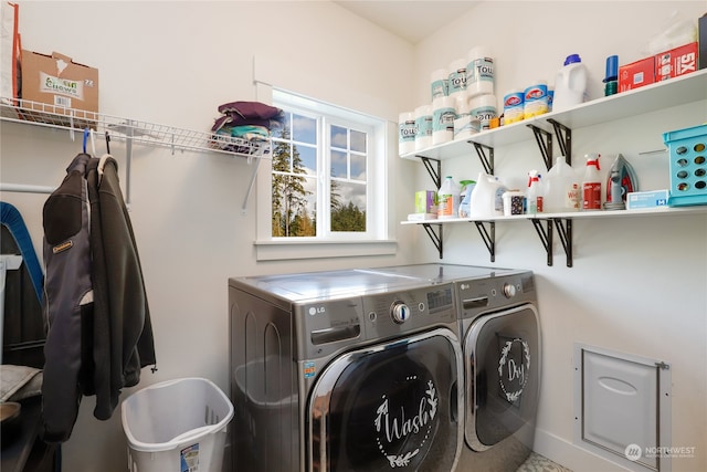 laundry room featuring washing machine and dryer