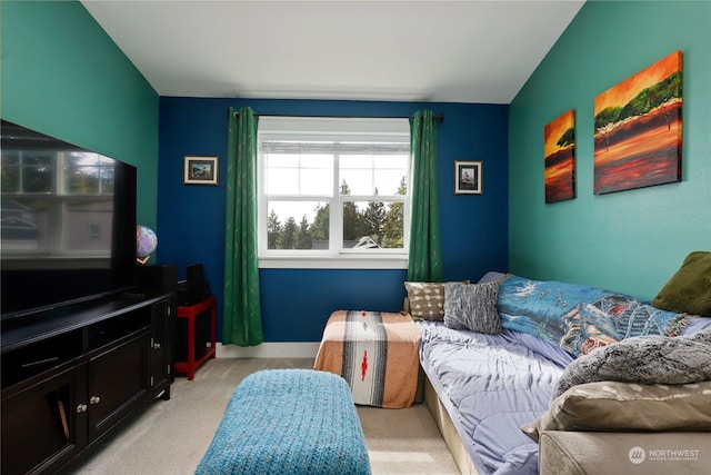 carpeted living room featuring lofted ceiling