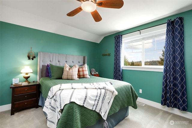 carpeted bedroom with lofted ceiling and ceiling fan