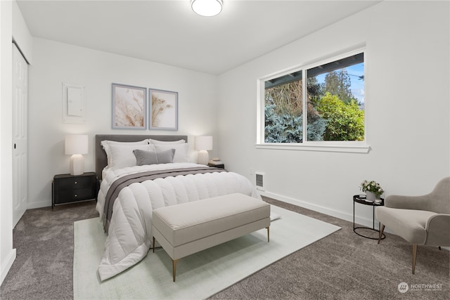 bedroom featuring dark colored carpet