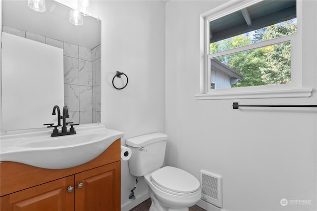 bathroom with vanity and toilet