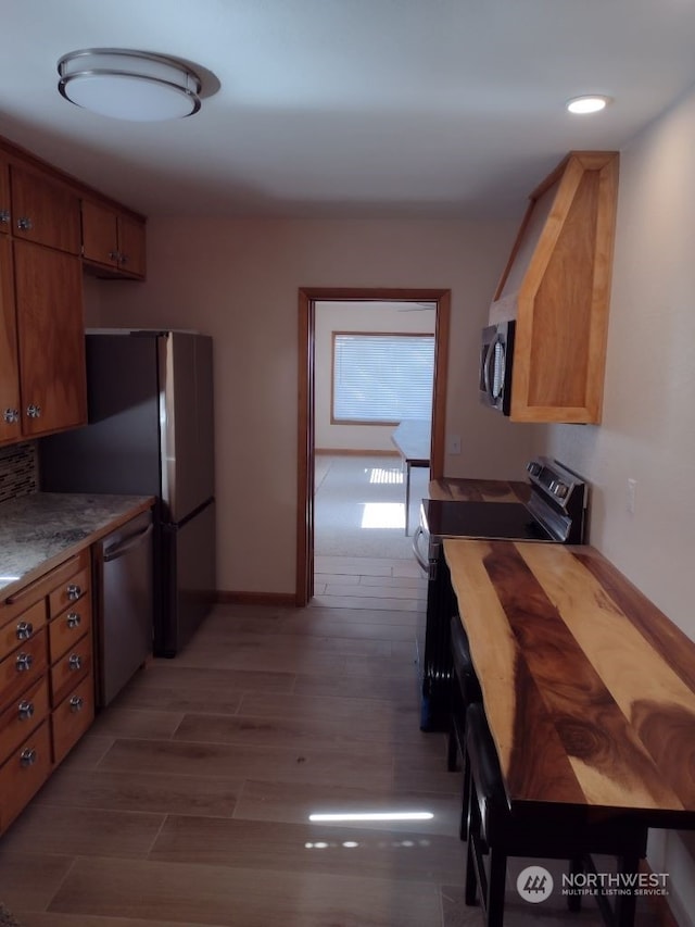 kitchen with black electric range, dishwasher, and dark wood-type flooring