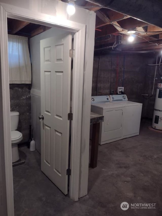 interior space featuring washing machine and clothes dryer and water heater