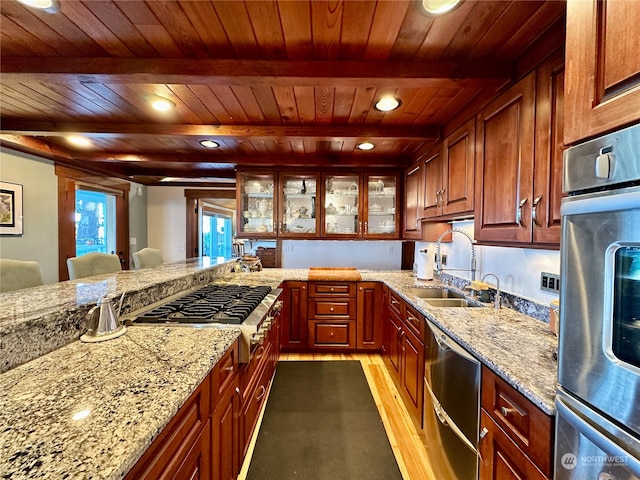 kitchen featuring beamed ceiling, appliances with stainless steel finishes, light wood-type flooring, and wooden ceiling