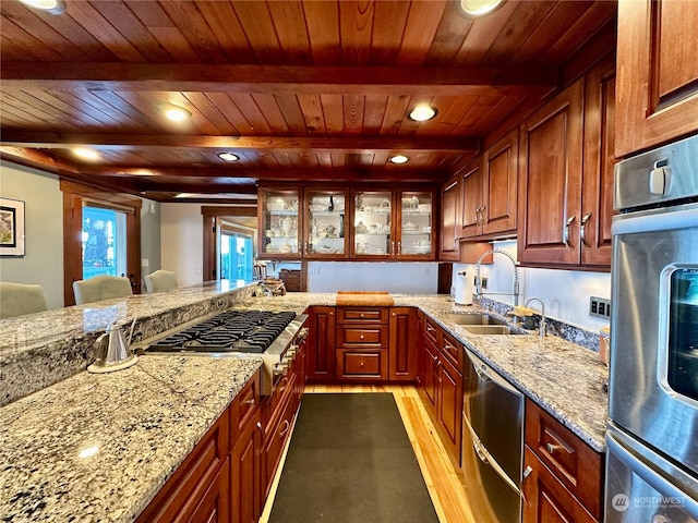 kitchen featuring wood ceiling, appliances with stainless steel finishes, light stone counters, and dark wood-style floors